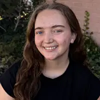 Headshot of Oakley, a smiling dental hygienist.
