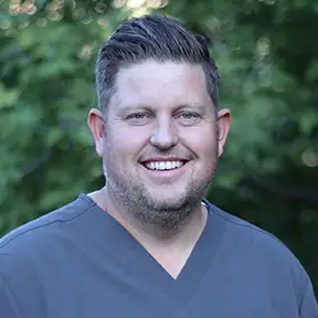 Professional headshot of Dr. Rowley, General & Cosmetic Dentist.