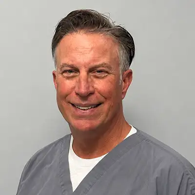 Professional headshot of Dr. Jay Yarbrough DDS smiling warmly.