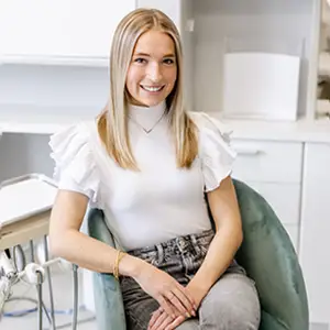 A calm, reassuring reception desk in a modern dental office with soft lighting, conveying immediate availability and care for patients in urgent need.