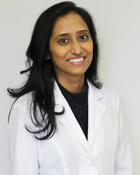 Professional headshot of Dr. Gaganjot Singh, DMD, smiling confidently.