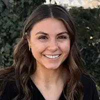 Headshot of Sydney, a smiling dental assistant.