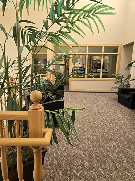 Modern office workspace transformation with collaborative seating areas.