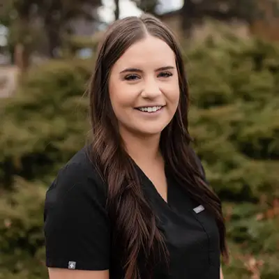 Headshot of Maddie, a smiling dental assistant, with a friendly expression.