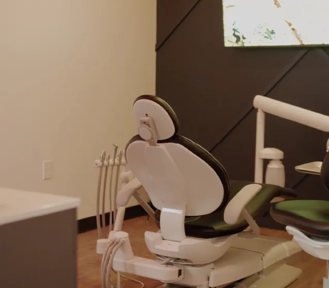 A calm, reassuring dental operatory room with modern equipment and soft lighting, suggesting a place where urgent care is delivered with skill and compassion rather than clinical coldness.