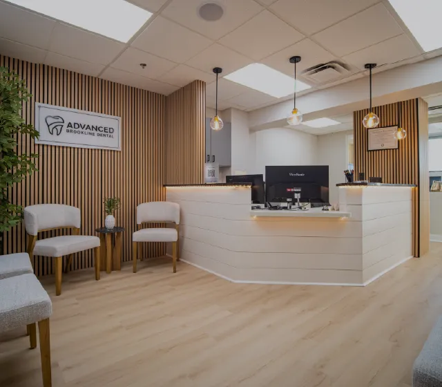 Advanced Brookline Dental logo with stylized text and dental imagery.