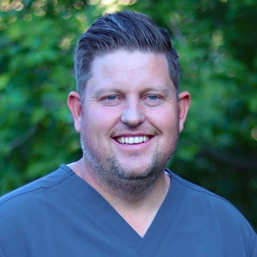 Professional headshot of Dr. Rowley, General & Cosmetic Dentist.