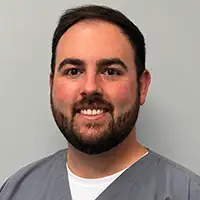 Professional headshot of Dr. Caleb Corley, a dentist.
