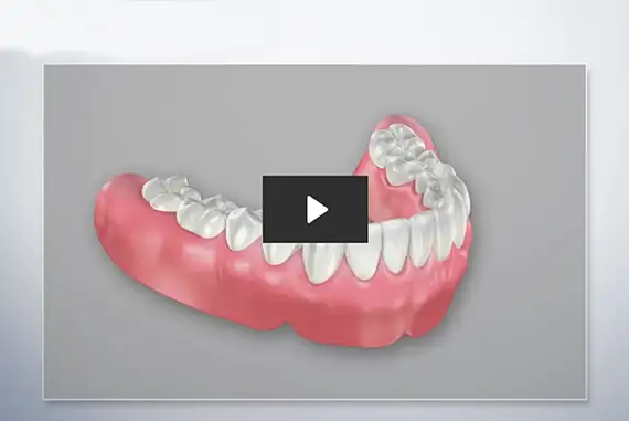 Natural-looking complete dentures displayed on a neutral background.